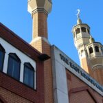 A stunning low-angle shot of East London Mosque, one of the holiest London Mosques highlighting its minaret