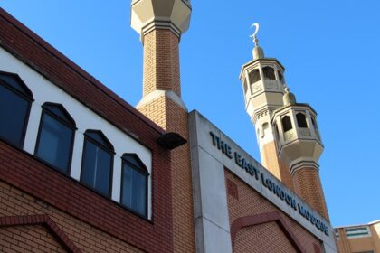 A stunning low-angle shot of East London Mosque, one of the holiest London Mosques highlighting its minaret