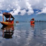 An image showcasing a serene view of the major lakes in India surrounded by beautiful landscapes.