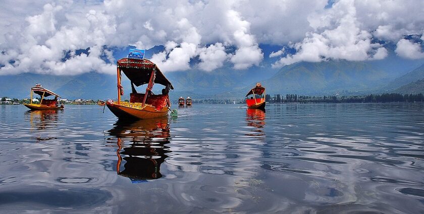 An image showcasing a serene view of the major lakes in India surrounded by beautiful landscapes.