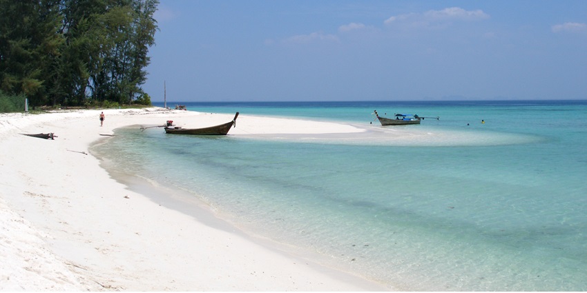 Tranquil escapes with soft sand and gentle lake waters.