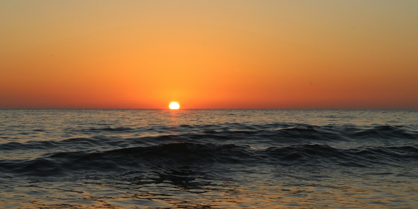 An image showing dusk at Mandvi Beach, showcasing one of the famous beaches in North India.