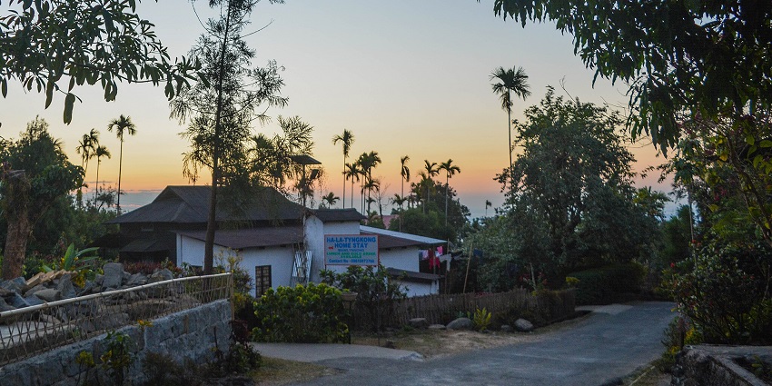 A picture of Mawlynnong Village, Asia’s cleanest village, with neatly maintained paths and vibrant flowers.