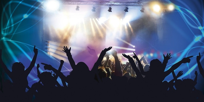 Image of people dancing and enjoying music in a nightclub offering the best nightlife in Helsinki.