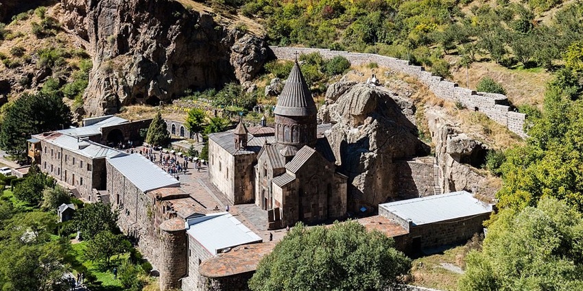 Geghard monastery is set in the middle of lush greenery.