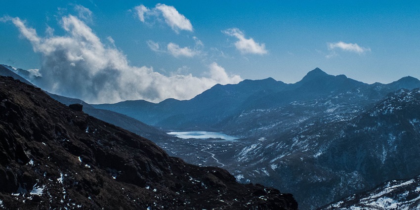 A breathtaking view of Menmecho Lake, surrounded by hills from Nathula near Changu Lake.