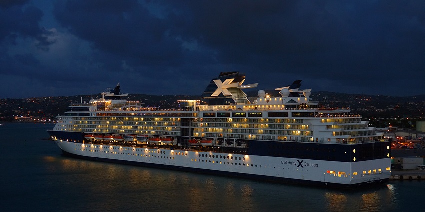 A nighttime view of a Cruise ship illuminated in Montego Bay under the Jamaican night sky