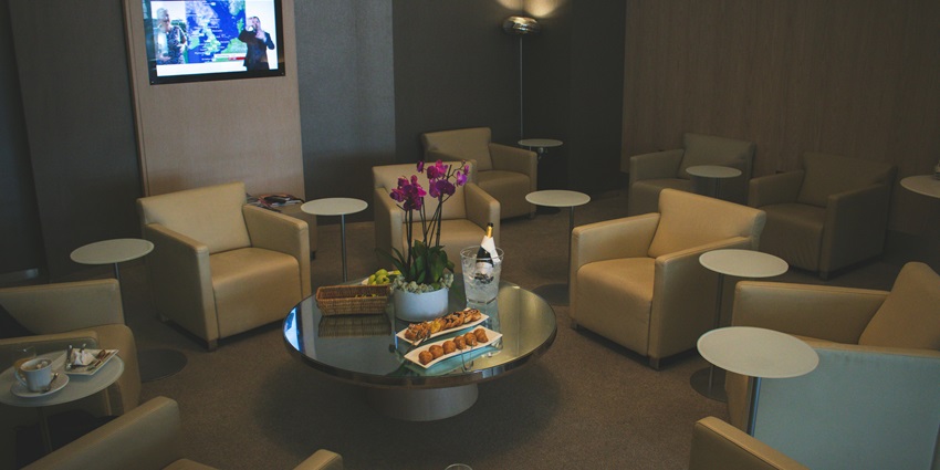 Image of White Sofa Chairs Near Tv - explore Moonlight Lounge, Vientiane