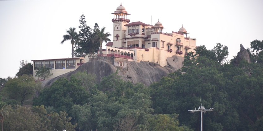 Jaipur House at Mount Abu with heritage architecture and lush green surroundings.