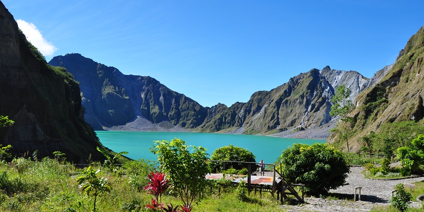 An image of Mount Pinatubo, a majestic volcano featuring a stunning crater lake and hikes.