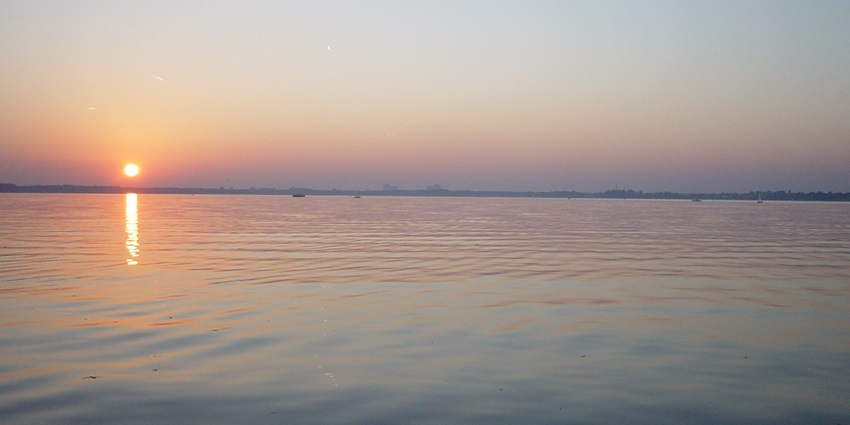 An image showing a sunset over Müggelsee, highlighting one of the beautiful beaches in Berlin