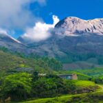 A mesmerising view of the hills peeking from the horizon in the sunny morning in Munnar, Kerala.