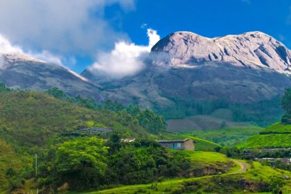 A mesmerising view of the hills peeking from the horizon in the sunny morning in Munnar, Kerala.