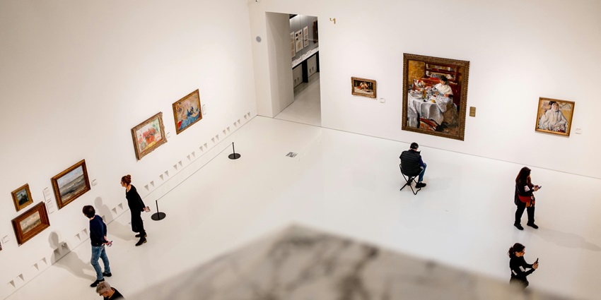 Visitors exploring art pieces in the Modern Art Museum Lisbon