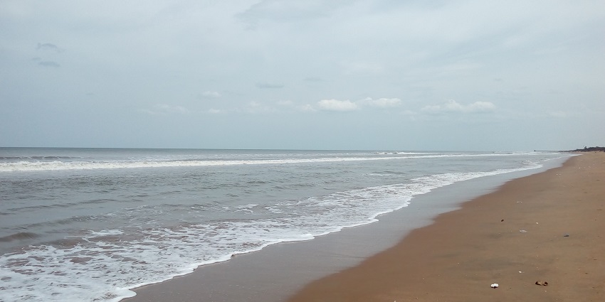 Mypadu Beach with golden sands and calm waters, showcased in the Nellore city guide.