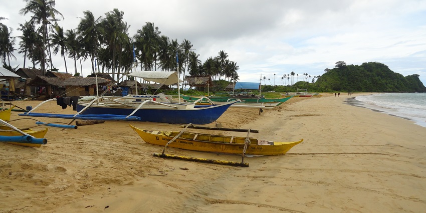 Nacpan Beach is among the best beaches in Palawan with golden sands and crystal-clear waters.