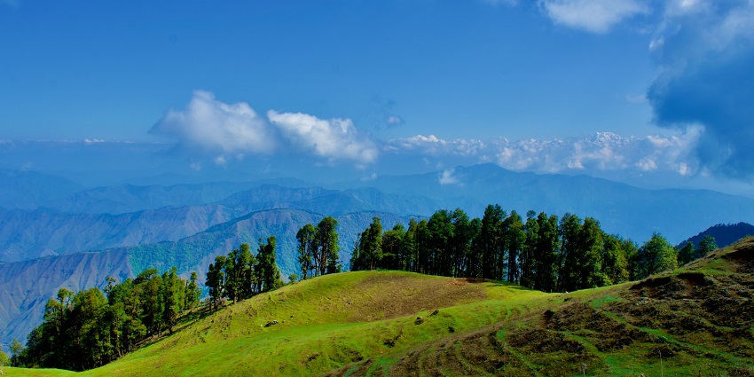 An image of snow on Nag Tibba, one of the best places for trekking in December in India.