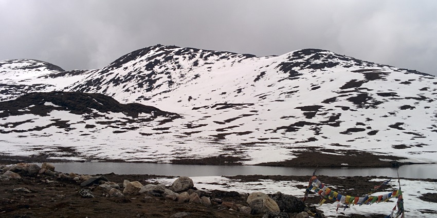 One of the lakes in Arunachal Pradesh, a narrow waterbody in Northeast India surrounded by mountains full of snow.
