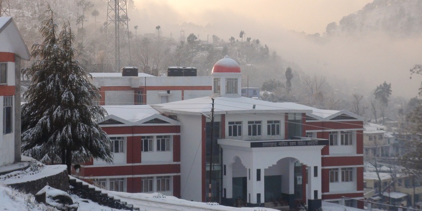 An image of the Uttarakhand Judicial and Legal Academy Bhowali Nainital building after snowfall.