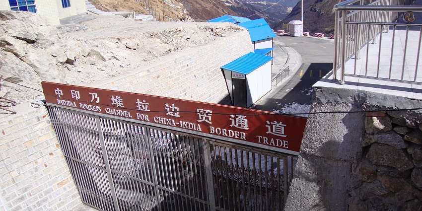 The view of the Nathula pass, Indo-China Border trade road surrounded by mountains.