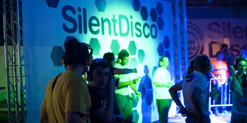 An Image of a crowd, enjoying a silent disco, similar to the one in the National History Museum