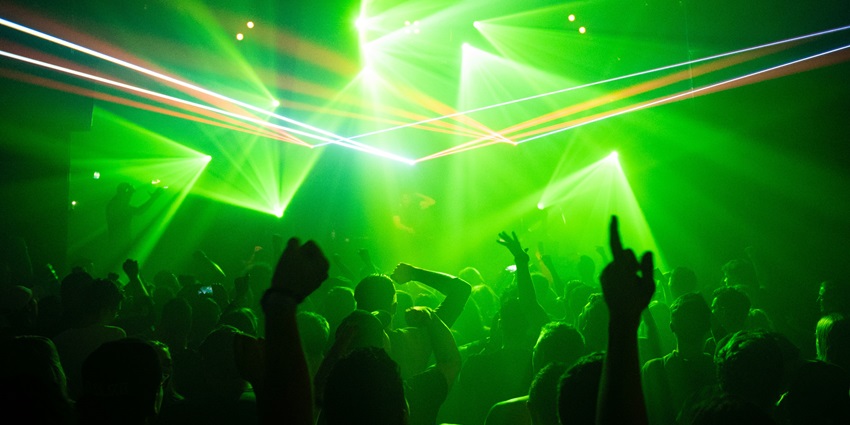 An image showing people dancing inside a club resembling the vibrant atmosphere of Neuraum