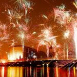 A vibrant image of New Year celebrations in Germany, showcasing a beautiful fireworks display