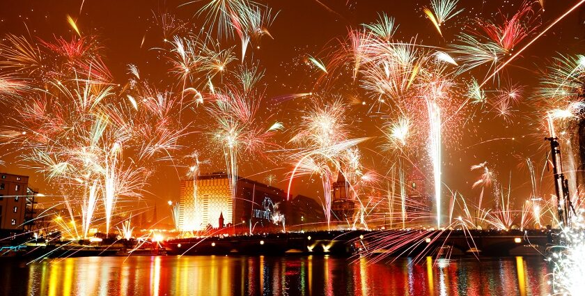 A vibrant image of New Year celebrations in Germany, showcasing a beautiful fireworks display