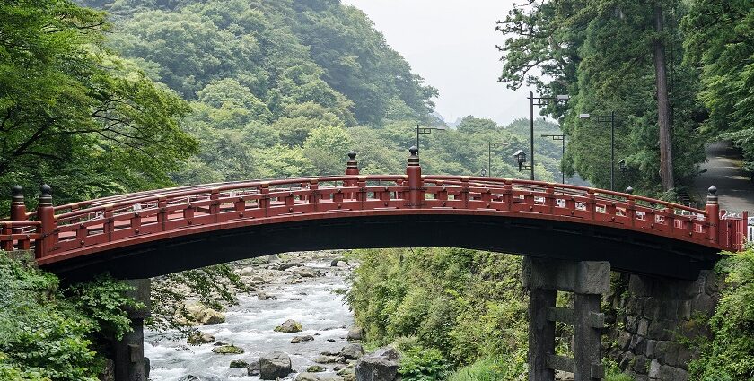 Nikko National Park features a sacred bridge, scenic landscapes, historic shrines, and diverse wildlife