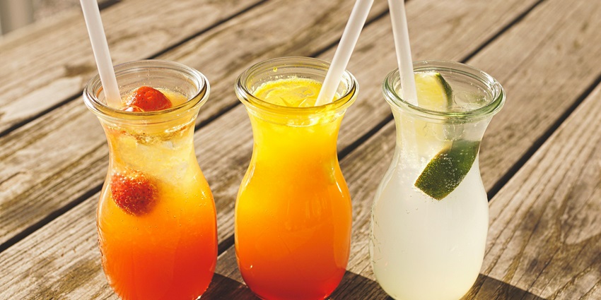 Three Assorted Fruit Juice in Glasses - Enjoy craft cocktails and a cozy vibe at Novem Cocktail Bar