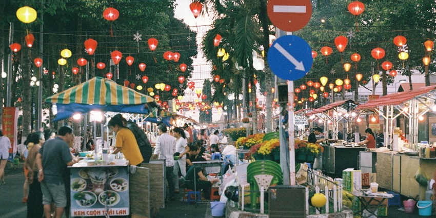 An image of a vibrant scene of the Old Market Square, filled with shops and visitors.