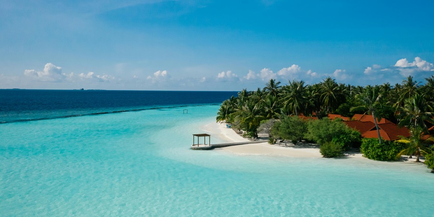 Remote paradise featuring pristine white sands and vibrant waters.
