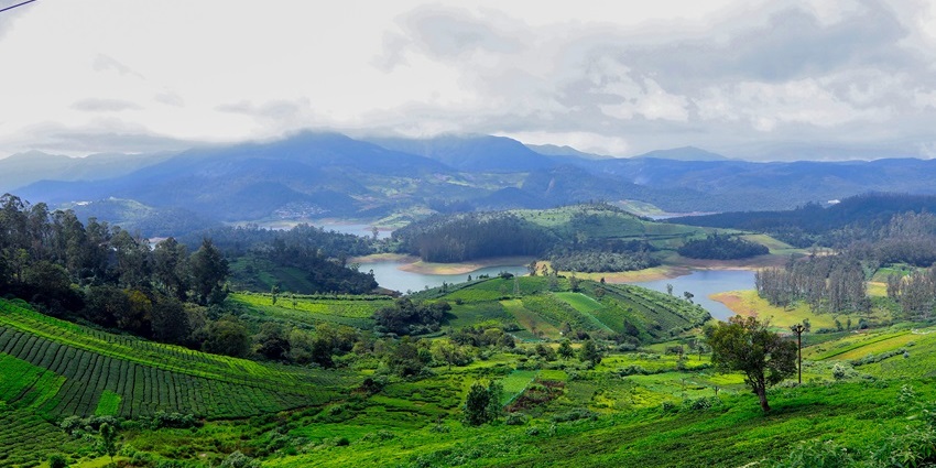 An awe-inspiring view of Ooty featuring majestic peaks and lush green valleys.