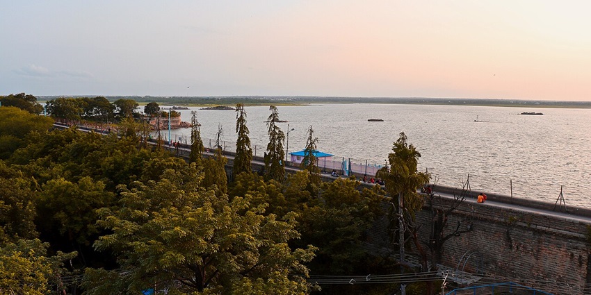 Osman Sagar, one of the lakes in Hyderabad with golden hues reflecting on the water.