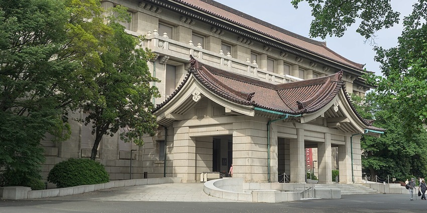 Tokyo National Museum illuminated at night, showcasing its stunning historic architecture