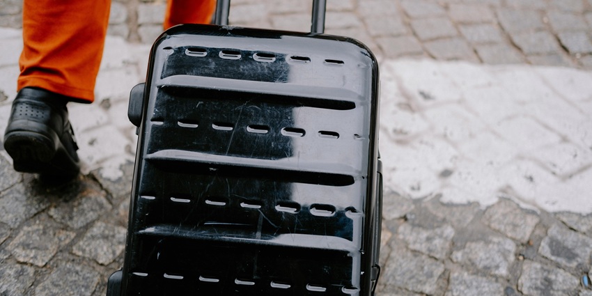 A suitcase with travel essentials, featuring tips for travellers to pack smart and travel efficiently.