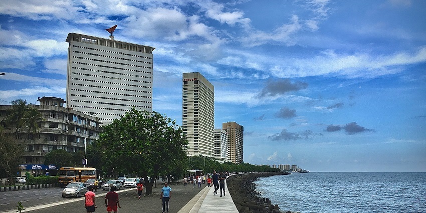 Image of a clear morning on the Marine Drive, Mumbai people strolling around