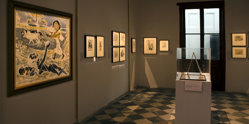 A picture of the gallery showcases art and cultural heritage exhibits.