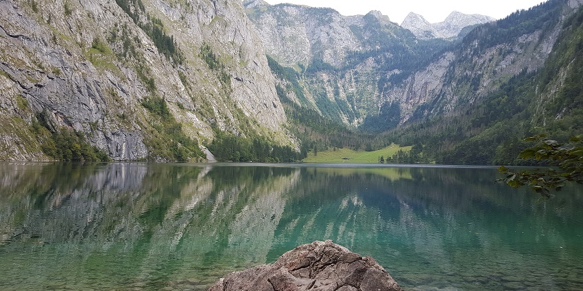 An image showing the tranquil Obersee lake, nestled in Berchtesgaden National Park, Germany.