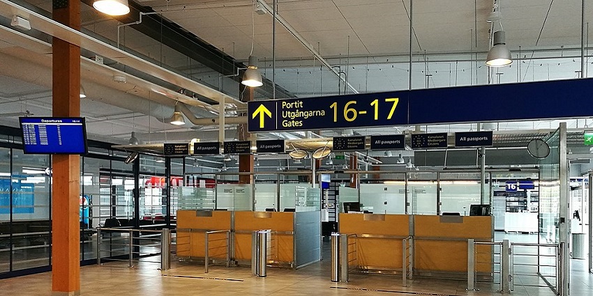 An image of the interior of Oulu Airport, featuring modern terminals and efficient facilities