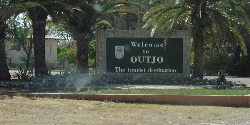 The entrance and the welcome board of the tourist destination are located in Namibia, Africa.