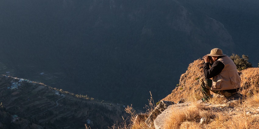 image of a person taking a picture from the hills of Pangot near Nainital in Uttarakhand