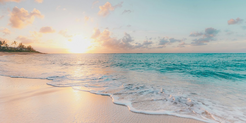 Stunning view of golden sands and aquatic blue water at beaches in South India