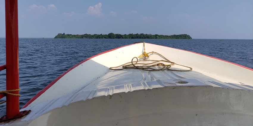 A boat approaches Pathiramanal Island on Vembanad Lake, the largest lake in India