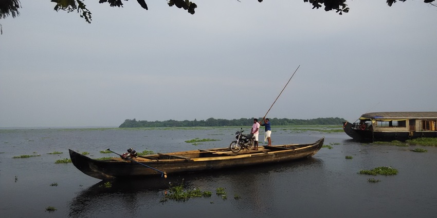 A picture of the lush green Pathiramanal Island amidst The Biggest Lake in India
