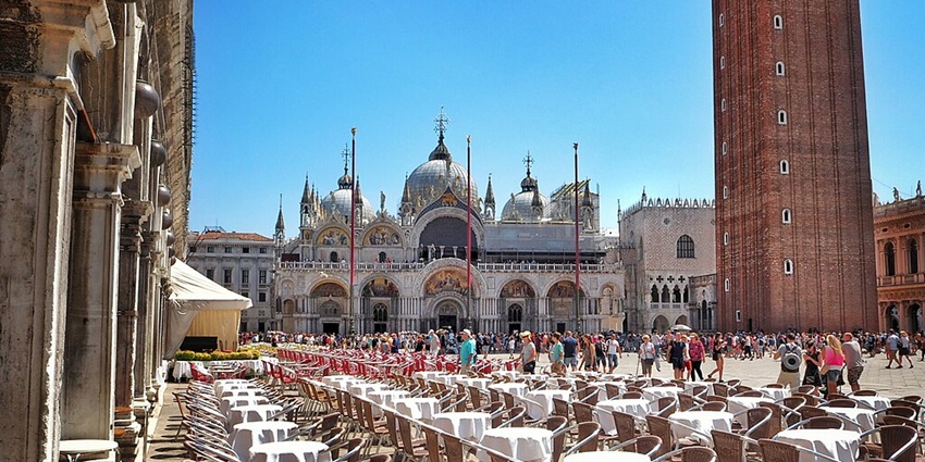 A dinner setup and celebrations of Valentine’s Day in Venice at Piazza San Marco.