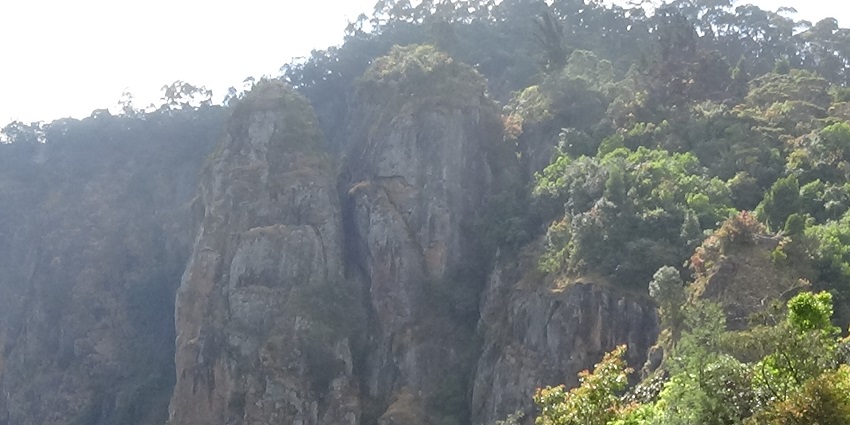 Famous Pillar Rocks at Kodaikanal with a dramatic background of clouds, Tamil Nadu