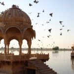 An image of Amar Sagar Lake in Jaisalmer, India, showcasing a soothing environment and peaceful surroundings.