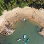 aerial view of people on beach during daytime - Places to visit in December in south India