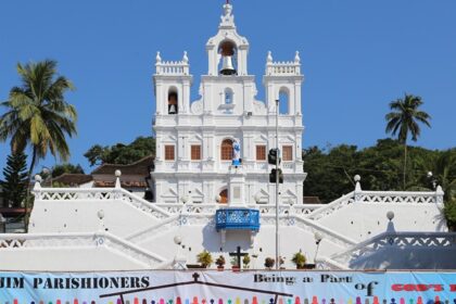 Statue of Virgin Mary in front and the bell tower on top. Panjim - A guide to diverse places to visit in Panjim at night